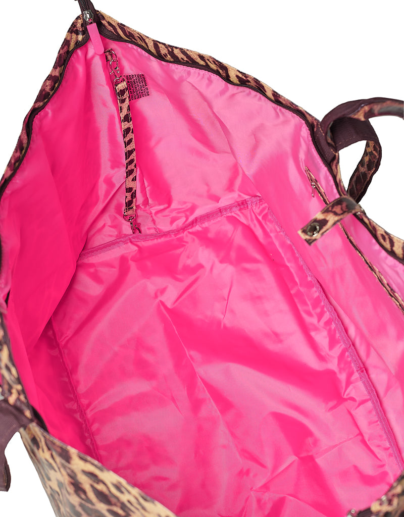 Pink inside of the leopard tote bag including leopard print strap and zippered inside pocket