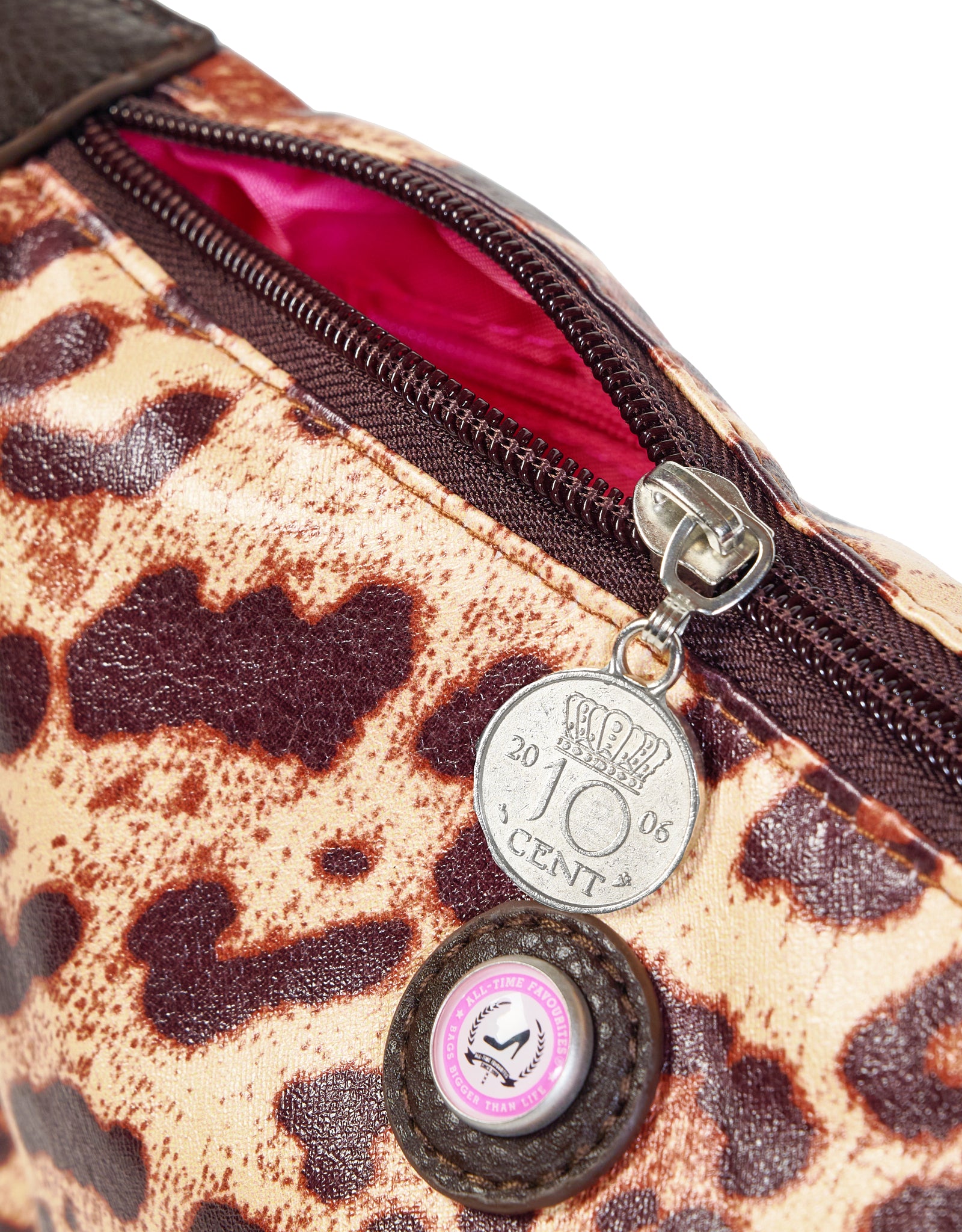 Close-up of zipper leopard makeup bag with lucky coin charm