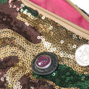 A toiletry bag with an army print and sequins, predominantly green, brown, and beige. Pink lining inside