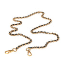 Gold crossbody chain with black leather on a white background