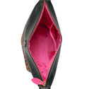 Inside of leopard toiletry bag with pink lining and zipper pocket
