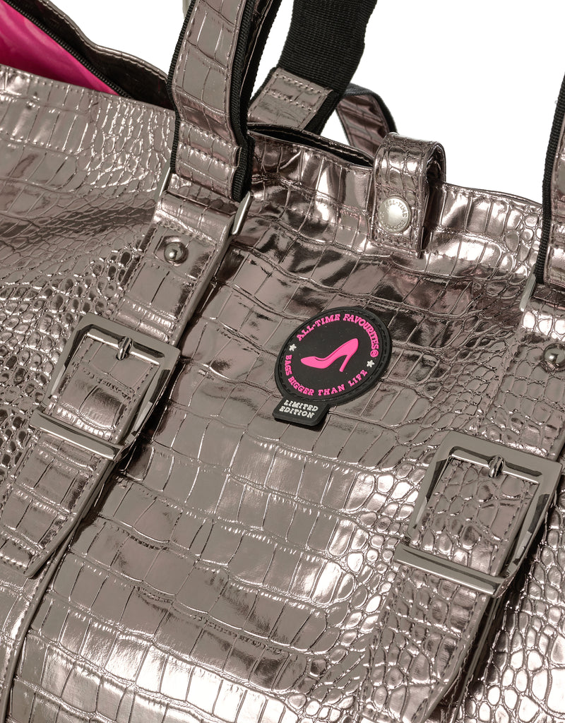 Silver textured handbag with a visible brand logo on a white background