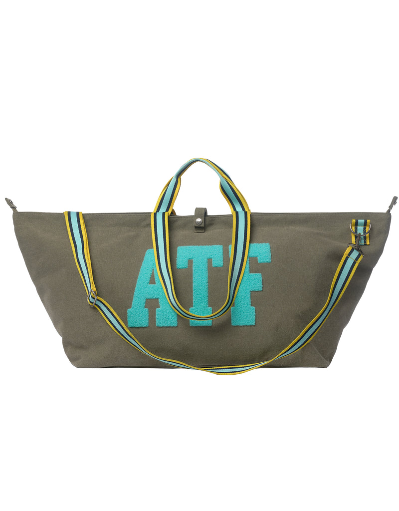 ATF large khaki canvas tote bag with striped handles and shoulder strap on a white background