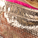 Detail of the gold python print material and pink lining inside the tote bag