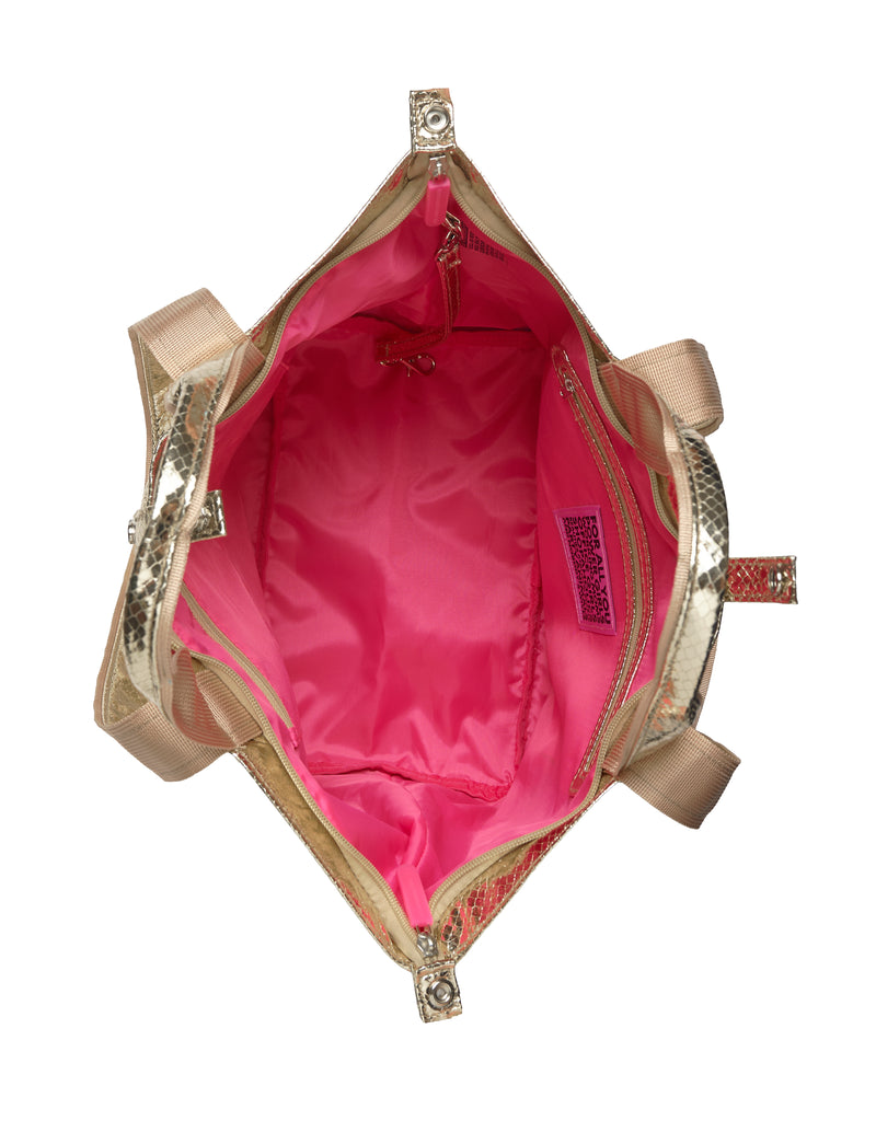 Gold handbag with pink interior on a white background