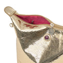 Detail of the champagne gold python print toiletry bag with inner zip pocket, coin zipper charm and logo