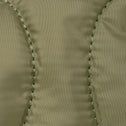 Close-up of arme green nylon fabric with stitching detail