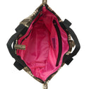 Interior of the Small Tote Bag Galle featuring bright pink lining, full zipper closure, two inner zip pockets and an interior strap to attach your ATF Toiletry Bag.