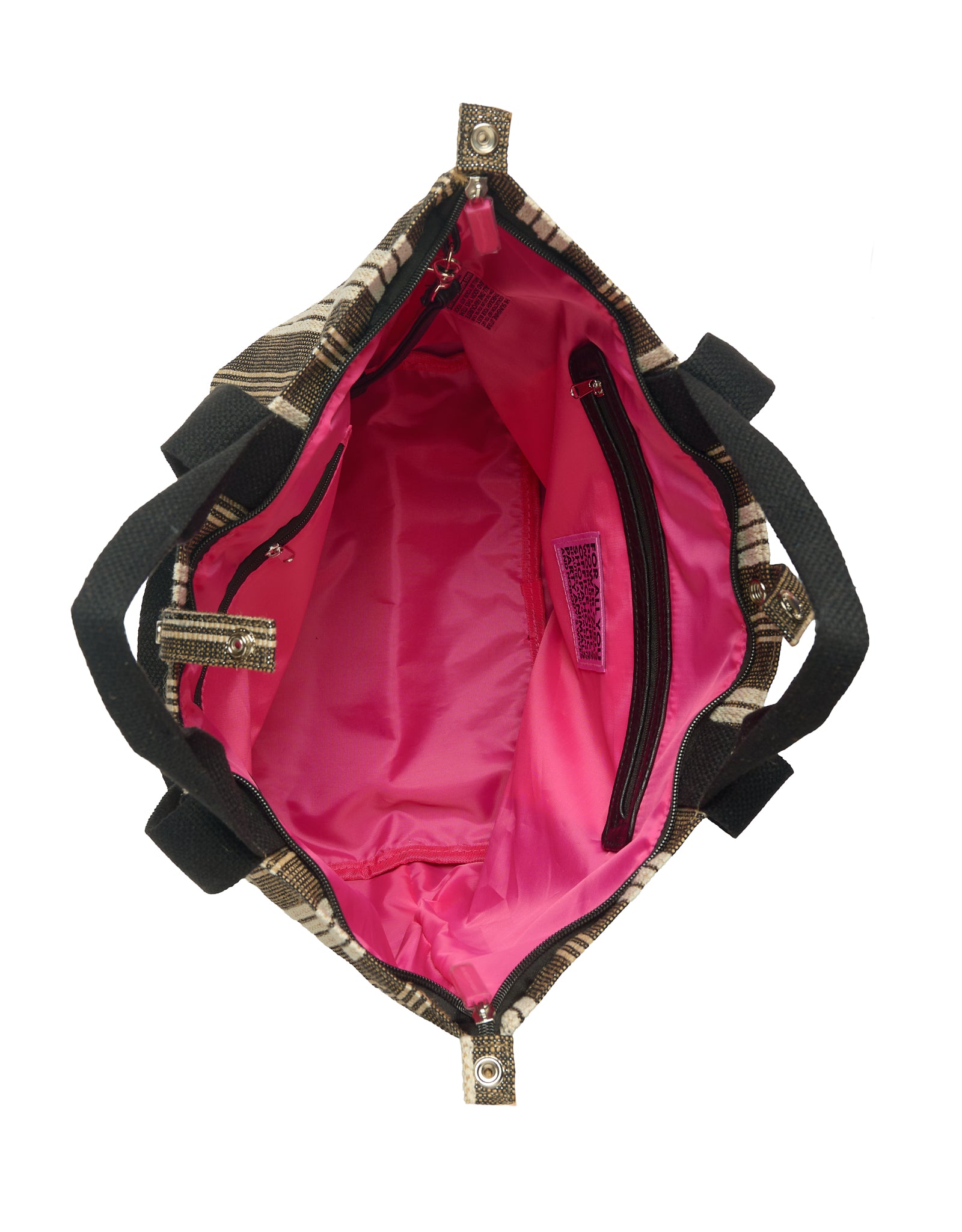 Interior of the Small Tote Bag Galle featuring bright pink lining, full zipper closure, two inner zip pockets and an interior strap to attach your ATF Toiletry Bag.