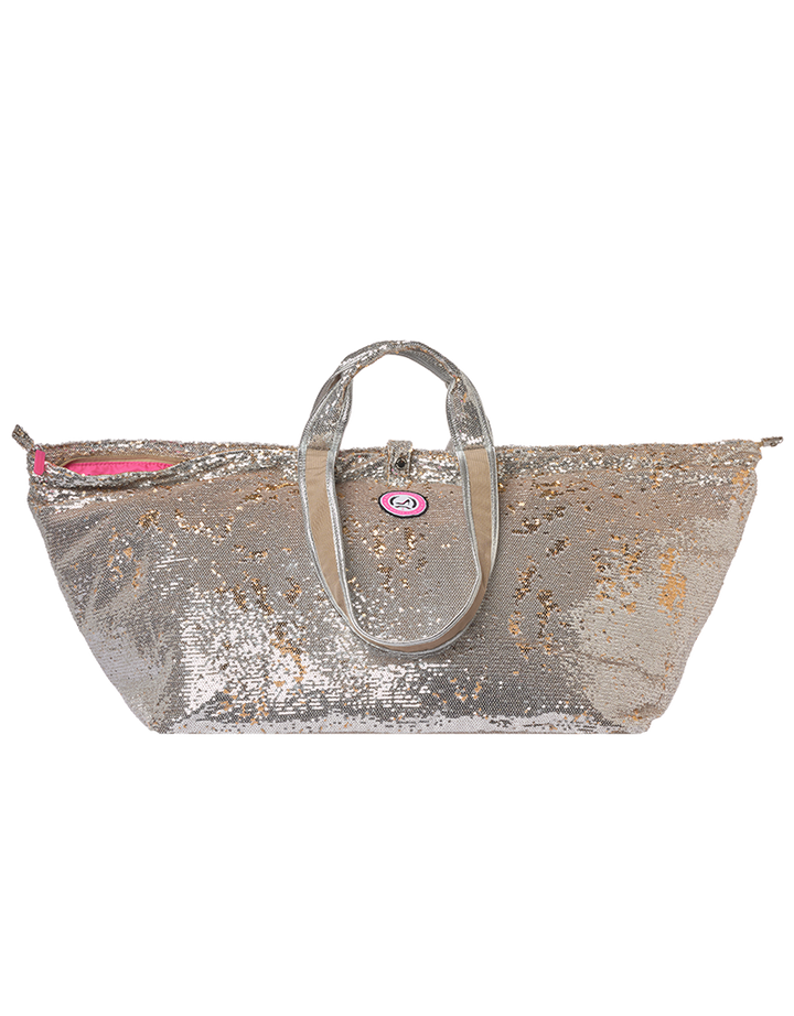 Grote tas van Mallorca met zilveren en gouden pailletten, korte hengsels, roze ritssluiting en rond logo op de voorkant.
