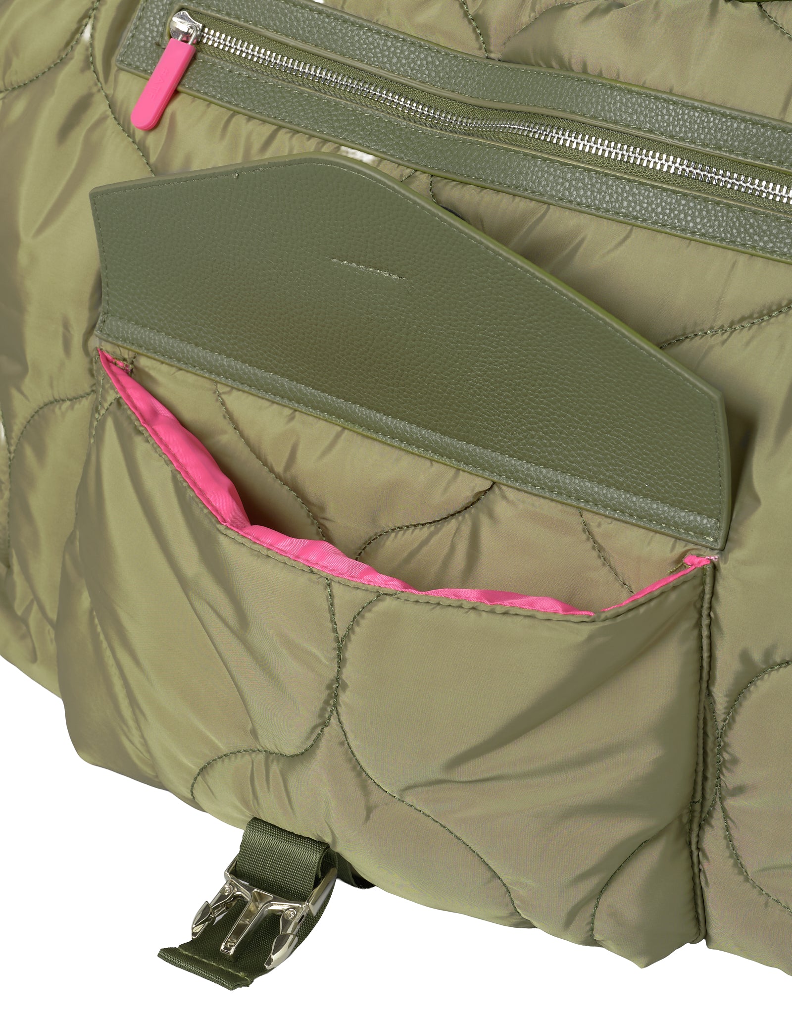 Close-up of a green quilted bag with pink interior a kangaroo pocket and visible buckle.