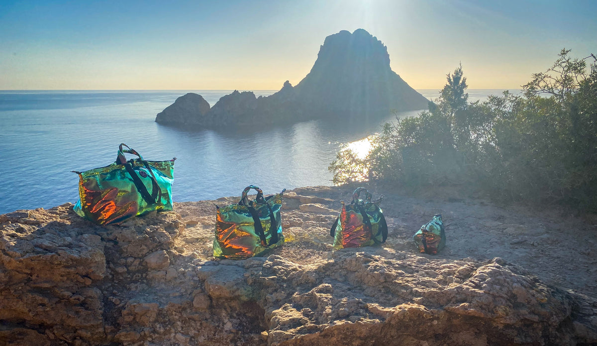 Ibiza bags on rocks with view on Es Vedra