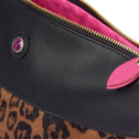 Leopard print toiletry bag in black vegan leather with golden zipper and pink lining