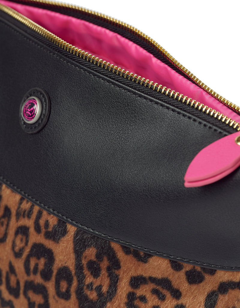 Leopard print toiletry bag in black vegan leather with golden zipper and pink lining