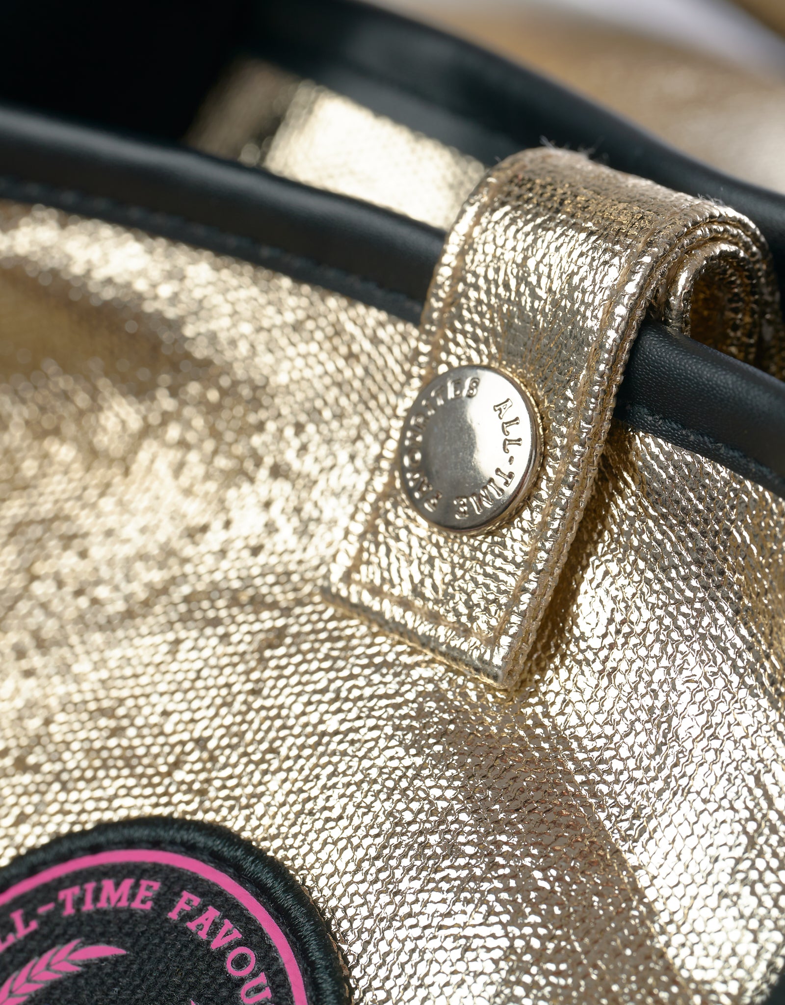 Close up of Jaipur Tote Bag with champagne gold coated cotton, snap button and All-time Favourites logo