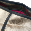Close-up of Jaipur Tote Bag in champagne gold coated cotton with black piping and pink lining detail