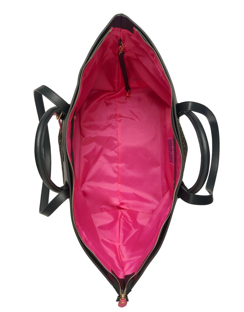 Inside of black resort tote bag with pink lining, small inside cord and zipper pocket in black vegan leather