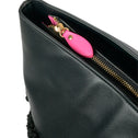 Black faux shearling medium tote bag with gold zipper, IMAN brand, modern design.