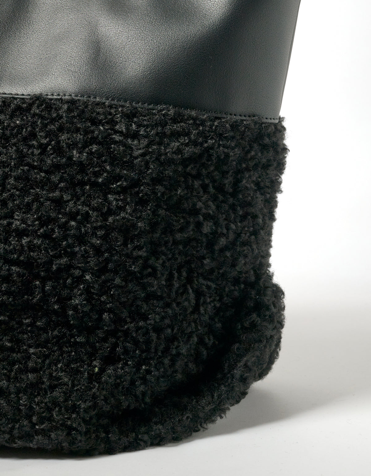 Black faux shearling medium tote bag by IMAN, All-time Favourites collection, shown on a white background.