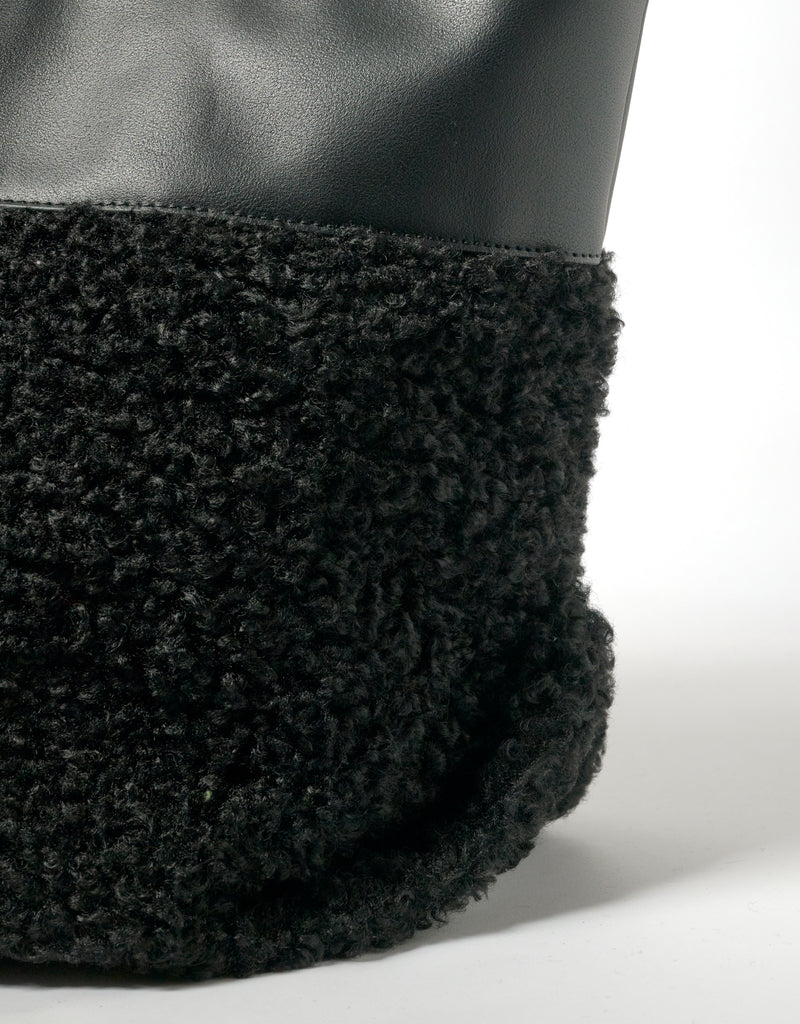 Black faux shearling medium tote bag by IMAN, All-time Favourites collection, shown on a white background.