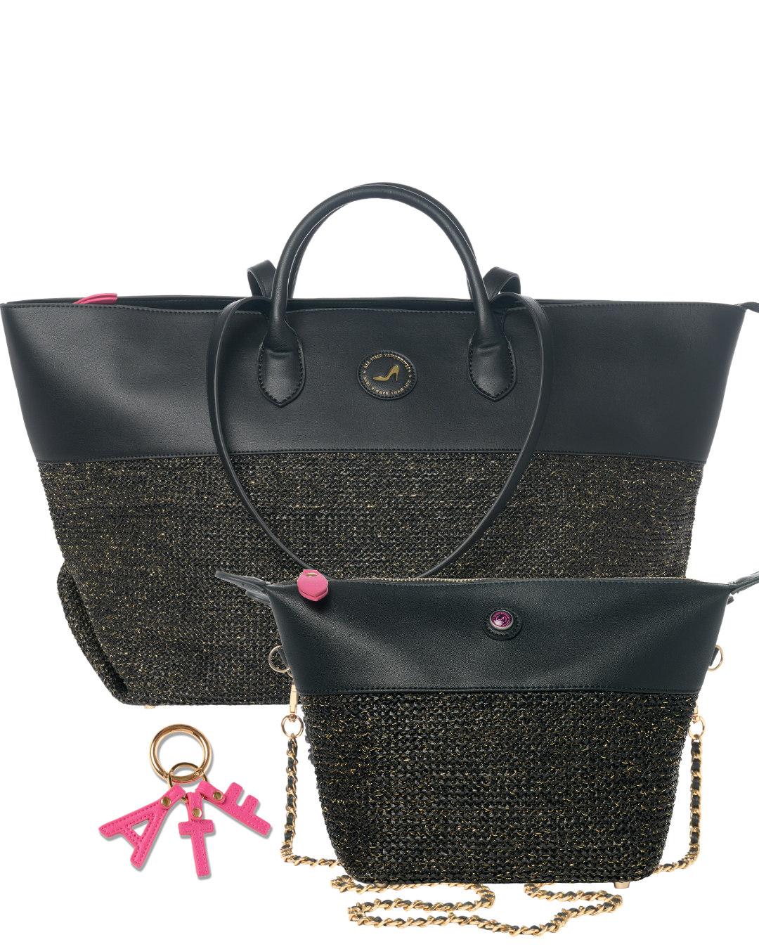A black leather and woven black-and-gold tote bag shown with a matching small pouch and pink keychain on a white background.