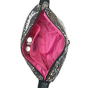 Sparkly black handbag with pink interior on a white background