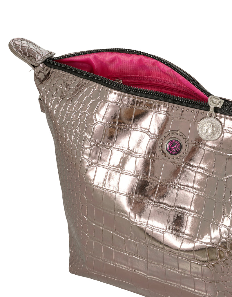Silver metallic toiletry bag with pink interior on a white background
