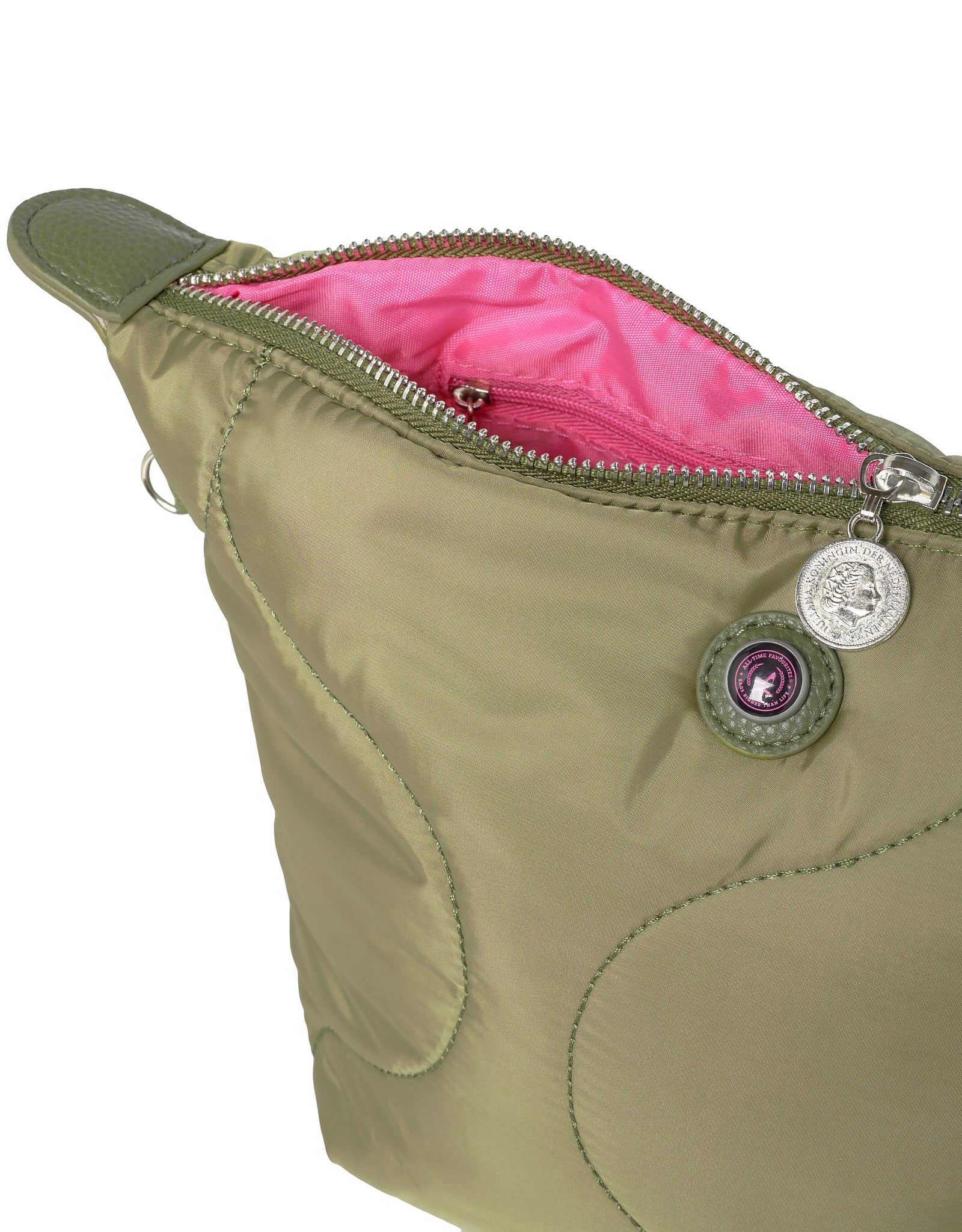 Close up of green toiletry bag with pink interior and decorative logo button on a white background