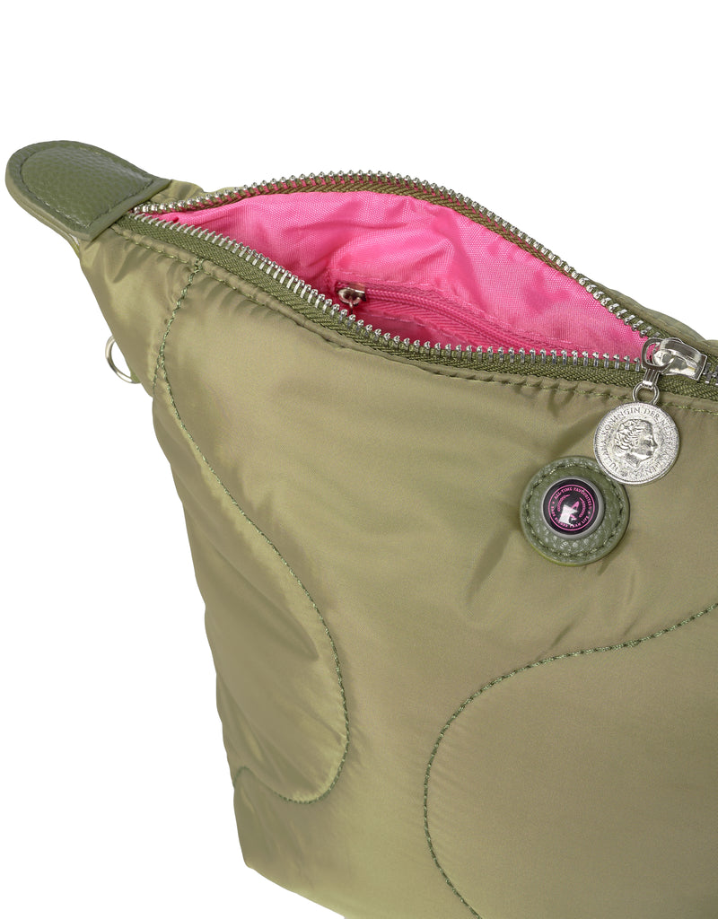 Close up of green toiletry bag with pink interior and decorative logo button on a white background