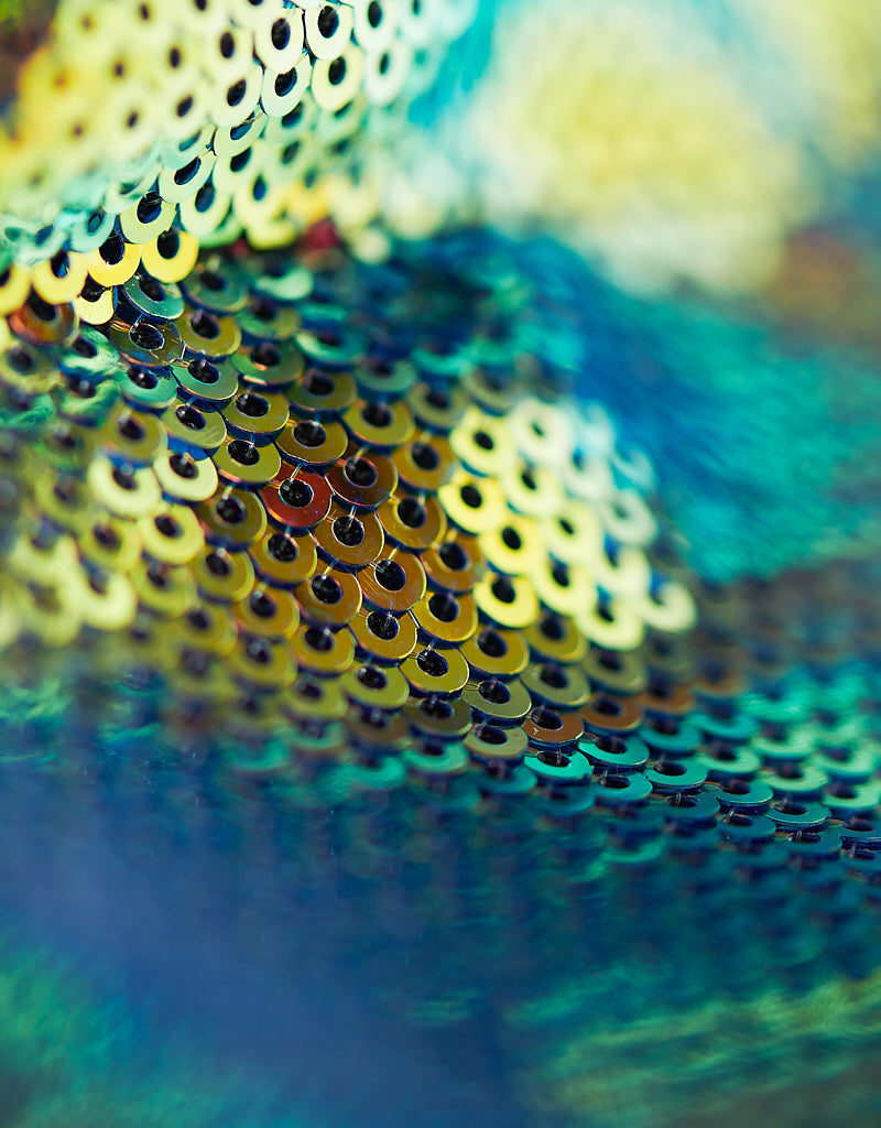 Close-up of blue and yellow sequins on IBIZA medium multicolor sequin tote bag, premium fashion accessory.
