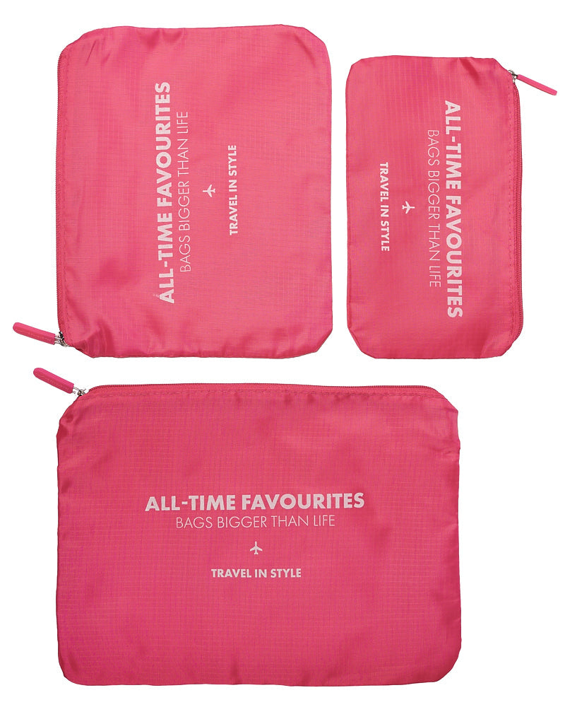 Three pink packing cubes from the Packing Cubes Travel Set are shown in different sizes, each labeled "ALL-TIME FAVOURITES BAGS BIGGER THAN LIFE - TRAVEL IN STYLE" in white text.